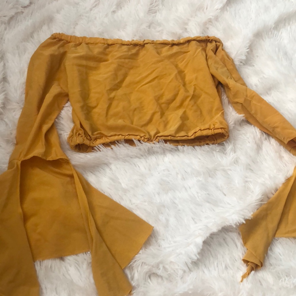 Gold over the shoulder crop top.